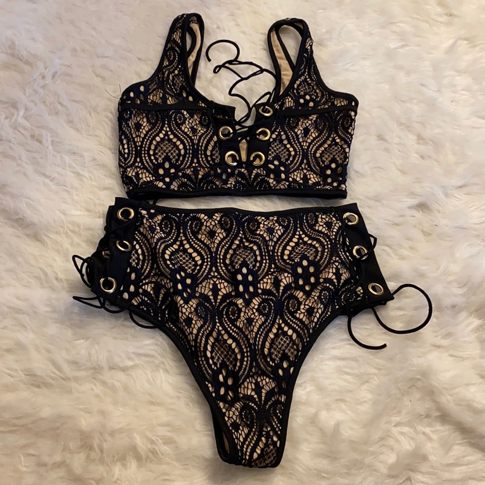 Black and being lace two piece bikini. Size large but fits small